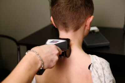 INSiGHT nervous system scan for a child at Rooted Family Chiropractic in Holland, MI